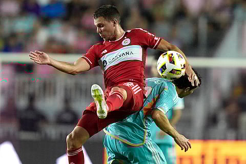 Arnaud Souquet goes for the ball against Leo Afonso